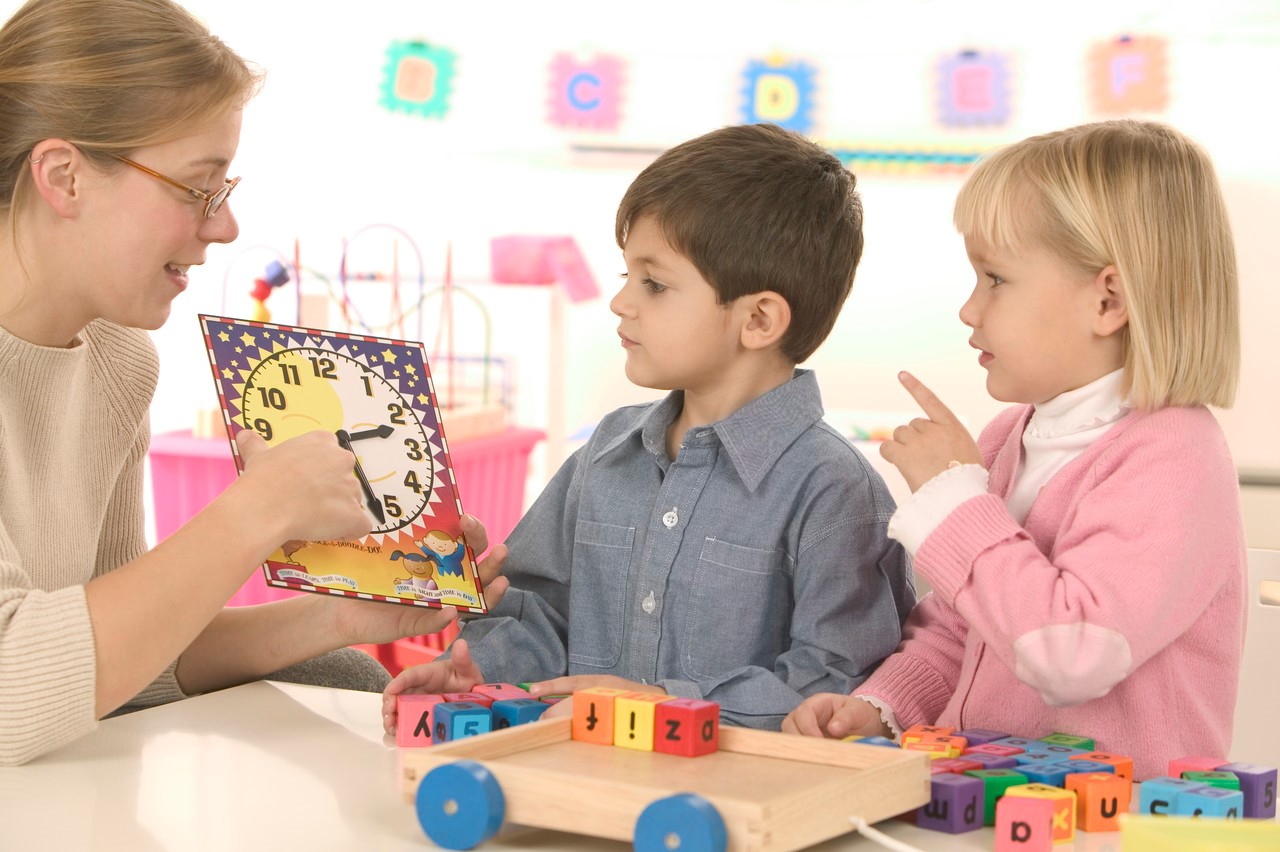 Teacher, boy, and girl 